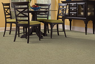 Dining room scene with green Softique carpet